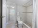 Updated bathroom with walk-in shower and gray tile at 313 Story Partin Rd, Orlando, FL 32833