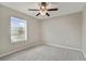 Bright bedroom with ceiling fan, neutral walls, and carpet flooring at 1209 Seburn Rd, Apopka, FL 32703