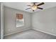 Bedroom with ceiling fan, neutral walls, and carpet flooring at 1209 Seburn Rd, Apopka, FL 32703