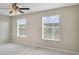 Bedroom with ceiling fan, neutral walls, and carpet flooring at 1209 Seburn Rd, Apopka, FL 32703