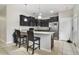 Modern kitchen with dark cabinetry and granite counters at 1209 Seburn Rd, Apopka, FL 32703