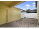 Private paved patio with yellow walls and access to a fenced yard at 1209 Seburn Rd, Apopka, FL 32703