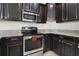 Stainless steel appliances and granite countertops in kitchen at 1209 Seburn Rd, Apopka, FL 32703