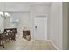 Bright entryway with tile flooring, neutral walls, and a view of the dining area at 1209 Seburn Rd, Apopka, FL 32703
