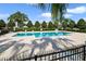 Community pool with lounge chairs and a fence at 1209 Seburn Rd, Apopka, FL 32703