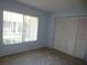 Spacious bedroom with large window and double door closet at 10320 La Guardia Ct, Orlando, FL 32821