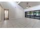 Living room with tile floors, high ceilings and access to a bathroom at 709 Del Rio Way, Kissimmee, FL 34758
