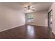 Large bedroom with ceiling fan and wood-look flooring at 709 Del Rio Way, Kissimmee, FL 34758
