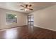Spacious bedroom with wood floors, sliding glass doors to patio at 709 Del Rio Way, Kissimmee, FL 34758