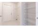 Laundry room with built-in shelving and exterior access at 709 Del Rio Way, Kissimmee, FL 34758