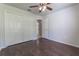 Bright bedroom with wood-look floors and double door closet at 709 Del Rio Way, Kissimmee, FL 34758