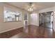 Living area with dark wood laminate flooring, kitchen views, and access to patio at 709 Del Rio Way, Kissimmee, FL 34758