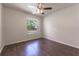 Well lit bedroom with wood flooring and window view at 709 Del Rio Way, Kissimmee, FL 34758