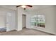 Well-lit bedroom featuring carpet, ample closet space, and a large window at 4070 Island Lakes Dr, Winter Haven, FL 33881