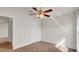 Bright bedroom with ceiling fan and plush carpeting at 4070 Island Lakes Dr, Winter Haven, FL 33881