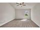 Bright bedroom with neutral walls and carpeted floor at 4070 Island Lakes Dr, Winter Haven, FL 33881