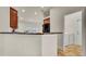 Kitchen features a breakfast bar, wood cabinets, and access to the laundry room at 4070 Island Lakes Dr, Winter Haven, FL 33881