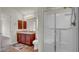 Bathroom with double sinks, shower, and toilet at 4070 Island Lakes Dr, Winter Haven, FL 33881