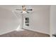 Simple bedroom with ceiling fan and window at 4070 Island Lakes Dr, Winter Haven, FL 33881
