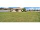 Spacious backyard with grassy area and privacy fence at 4070 Island Lakes Dr, Winter Haven, FL 33881