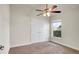 Bright bedroom with double-door closet and ceiling fan at 4070 Island Lakes Dr, Winter Haven, FL 33881