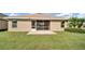 Landscaped backyard with screened porch and patio at 4070 Island Lakes Dr, Winter Haven, FL 33881