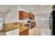 Kitchen with granite countertops and dark wood cabinets at 4070 Island Lakes Dr, Winter Haven, FL 33881