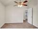 Bedroom with ceiling fan and access to another room at 4070 Island Lakes Dr, Winter Haven, FL 33881