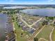Aerial view showcasing a waterfront community, featuring houses and boat docks at 4070 Island Lakes Dr, Winter Haven, FL 33881