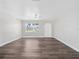 Open concept living room with neutral decor and vinyl flooring at 5400 Fox Briar Trl, Orlando, FL 32808