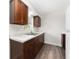 Kitchen features wood cabinets and a granite countertop at 5400 Fox Briar Trl, Orlando, FL 32808