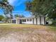 Charming ranch home featuring a newly painted exterior and landscaping at 5400 Fox Briar Trl, Orlando, FL 32808