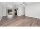 Living room with wood-look floors and sliding glass doors at 5400 Fox Briar Trl, Orlando, FL 32808