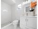 Modern bathroom with white vanity, updated fixtures, and a walk-in shower at 5400 Fox Briar Trl, Orlando, FL 32808