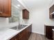 View of kitchen with wood cabinets and a granite countertop at 5400 Fox Briar Trl, Orlando, FL 32808