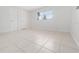 Simple bedroom with neutral walls and tile flooring at 5400 Fox Briar Trl, Orlando, FL 32808