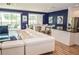 Open living area featuring a large sectional sofa and access to a pool at 2621 Calistoga Ave, Kissimmee, FL 34741