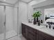 Double vanity bathroom with a large shower and modern fixtures at 4108 Sadler Rd, Apopka, FL 32712