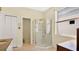 Bathroom features a large glass shower and tile flooring at 8432 Abbotsbury Dr, Windermere, FL 34786