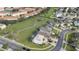 Aerial view of a neighborhood with a playground, homes, and palm trees at 4817 Cumbrian Lakes Dr, Kissimmee, FL 34746