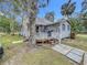Charming house exterior with a spacious yard and a deck at 1017 Mabbette St, Kissimmee, FL 34741