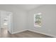 Bright bedroom with wood-look floors and a window at 2161 Sw 156Th Pl, Ocala, FL 34473