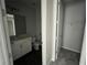 Clean bathroom with toilet, sink, and walk-in closet at 3287 Roseville Dr, Apopka, FL 32712