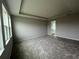Bright bedroom with carpet and access to bathroom at 3287 Roseville Dr, Apopka, FL 32712