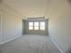 Spacious bedroom with carpet flooring and multiple windows at 3287 Roseville Dr, Apopka, FL 32712