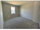 Simple bedroom with carpet and a single window at 3287 Roseville Dr, Apopka, FL 32712