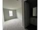 Bright bedroom with ensuite bathroom and carpet flooring at 3287 Roseville Dr, Apopka, FL 32712