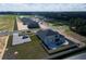 Aerial view of a house with pool, gray siding, and dark roof at 3287 Roseville Dr, Apopka, FL 32712