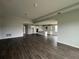 Spacious living room with dark gray tile floors and views into the kitchen at 3287 Roseville Dr, Apopka, FL 32712