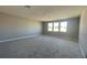 Large bedroom with grey walls and carpet flooring at 3295 Roseville Dr, Apopka, FL 32712